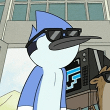 a cartoon bird wearing sunglasses is standing in front of a tv .