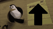 a penguin is sticking its head out of a hole next to an arrow pointing upwards