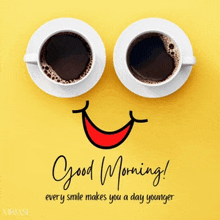 two cups of coffee with a smiling face and the words good morning