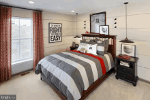 a bedroom with a bed and a sign on the wall that says " do what is right not what is easy "