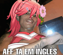 a man with pink hair and a flower in his hair has the words aff ta em ingles on his arm