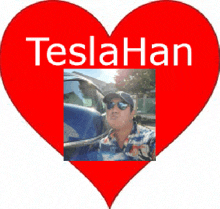 a red heart with a picture of a man and the words teslahan