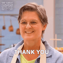 a woman is smiling and saying thank you in front of a sign that says the great canadian baking show