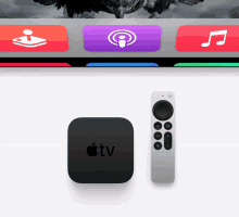 a black apple tv box and a remote control