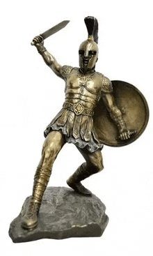 a bronze statue of a spartan warrior holding a sword and shield .