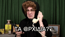 a man wearing a wig and glasses is talking on a phone with the words ta @pxidia written on the bottom