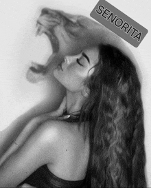 a black and white photo of a woman with a lion behind her and the name senorita