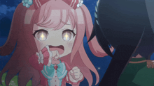 a little girl with pink hair and a bow on her head
