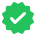 a green check mark icon with a white check mark inside of it on a white background .