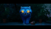 a blue cat with bright orange eyes is standing in the dark