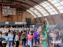 an advertisement for l' age d' or shows people dancing in a gym