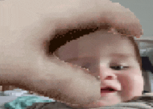 a pixelated image of a baby with a man 's face behind it .