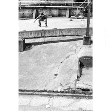 a skateboarder is doing a trick on a concrete ramp