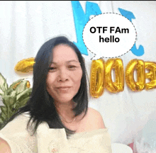 a woman stands in front of balloons and a speech bubble that says otf fam hello