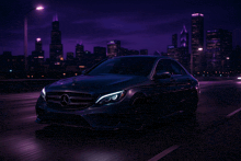 a mercedes driving down a highway at night