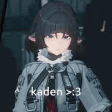 a girl in a gray jacket with the word kaden on it