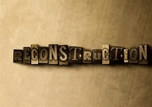 the word reconstruction is written in vintage wooden letterpress type on a brown background .