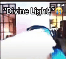 a person is crying in a living room with the words `` divine light '' written on the screen .