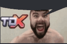 a shirtless man with a beard is screaming in front of a speech bubble that says tox .