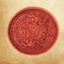 a close up of a red coin on a piece of paper .