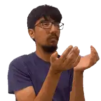 a man wearing glasses is clapping his hands
