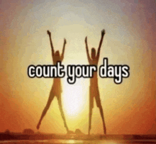 a picture of two people jumping in the air with the words count your days above them