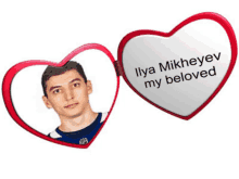 a heart shaped mirror with a picture of a man and the words ilya mikheyev my beloved