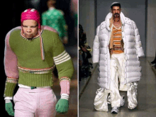 a man in a green sweater and a man in a white coat are walking down a runway at a fashion show .