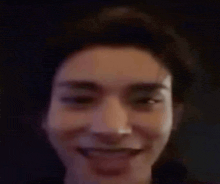 a close up of a person 's face with a smile on their face .