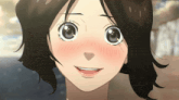 a close up of a girl 's face with a smile