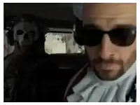 a man wearing sunglasses is standing next to a man with a skull on his face
