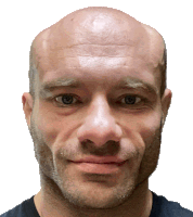 a close up of a man 's face with a bald head