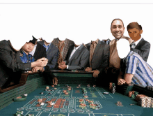 a group of men are playing a game of roulette with their faces cut out