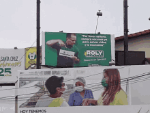 a billboard for poly alcalde shows a man pointing at a sign