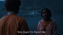 a man and a woman are talking and the words you have to trust me are above them