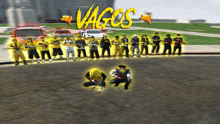 a group of people are standing in front of the word vagos