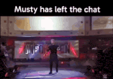 a man standing on a stage with the words musty has left the chat