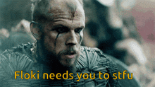 a close up of a man with the words floki needs you to stfu on the bottom