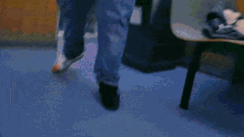 a blurry picture of a person 's legs and feet