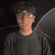 a man wearing glasses and a shirt that says ronan on it