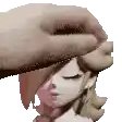 a hand is touching a doll 's head with its fingers .