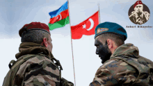 two soldiers standing in front of flags with askeri hikayeler written in the corner