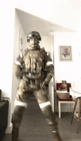 a man in a military uniform is standing in a hallway