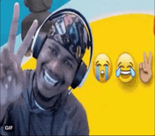 a man wearing headphones and a bandana is smiling and giving a peace sign in front of a yellow background .