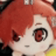 a close up of a stuffed animal with red hair and red eyes