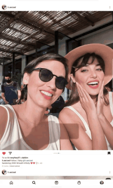 two women wearing sunglasses and hats are posing for a photo