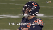 a football player wearing a bears helmet is standing on a field and says `` the iceman cometh '' .