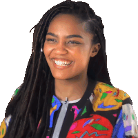 a woman with dreadlocks and a colorful jacket is smiling