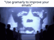 a group of people are looking at a screen that says " use grammarily to improve your emails "