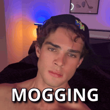 a man wearing a hat with the word mogging written on it